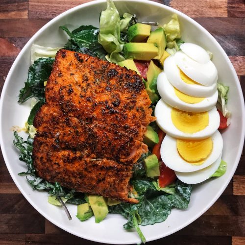 Blackened salmon salad on cutting board