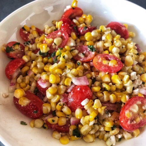 corn salad bowl with dark background